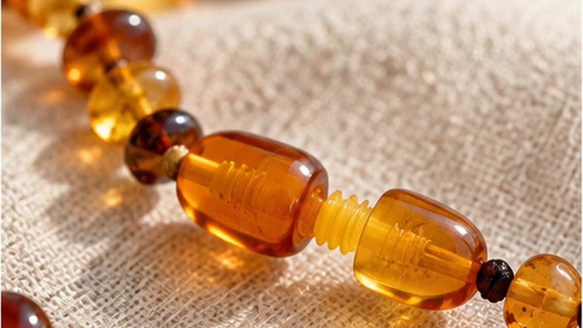 Baltic amber teething necklace close-up on natural fabric